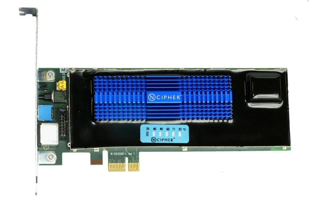 A hardware security module on a PCIe card, photographed against a white background. Most of the board is covered by a black potted enclosure with a blue finned heatsink set into it, printed with the manufacturer’s name. A small strip of temperature indicator dots runs along the lower edge of the potting, marked 29, 40, 49, 60, 71 and 82 degrees. The gold PCIe contacts and a metal mounting bracket are visible at the edges.